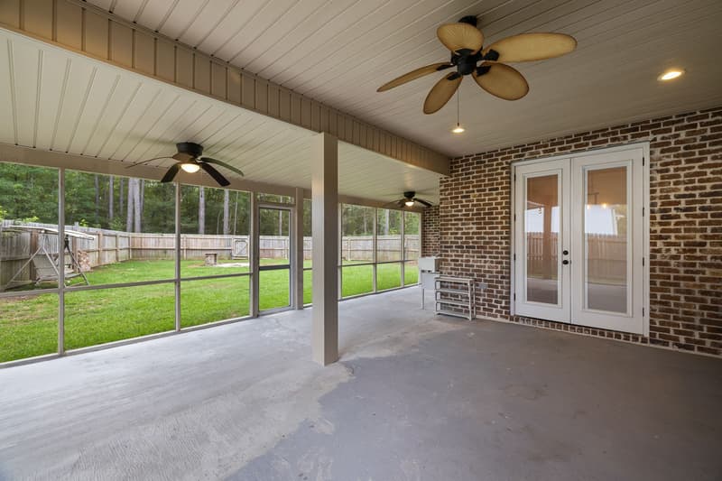 Screened porch backyard view at 30 Broad Leaf Cove, Petal, Mississippi