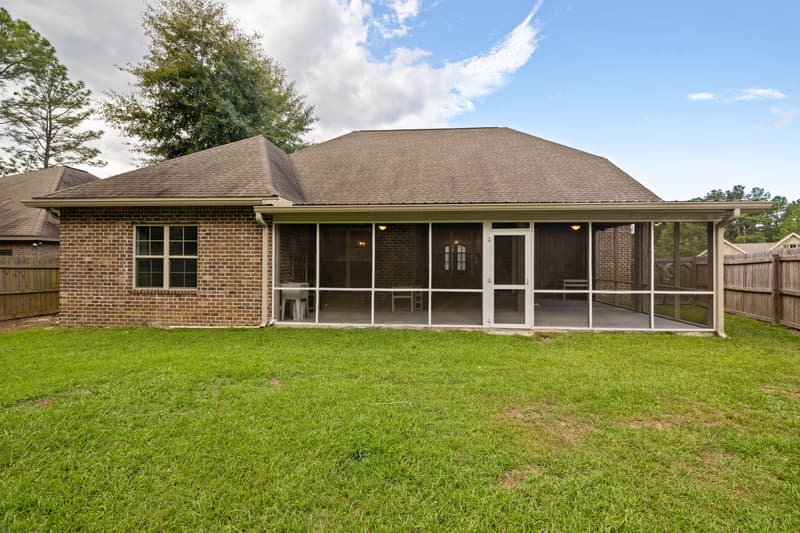 Screened porch and rear exterior at 30 Broad Leaf Cove, Petal, Mississippi