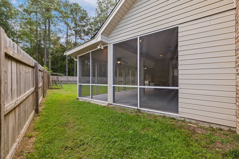 Side yard screened porch at 30 Broad Leaf Cove, Petal, Mississippi