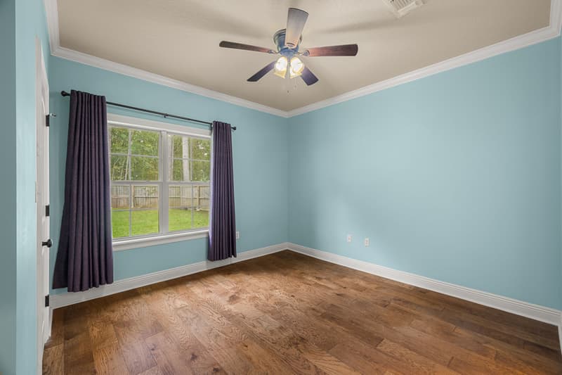 Blue bedroom window at 30 Broad Leaf Cove, Petal, Mississippi